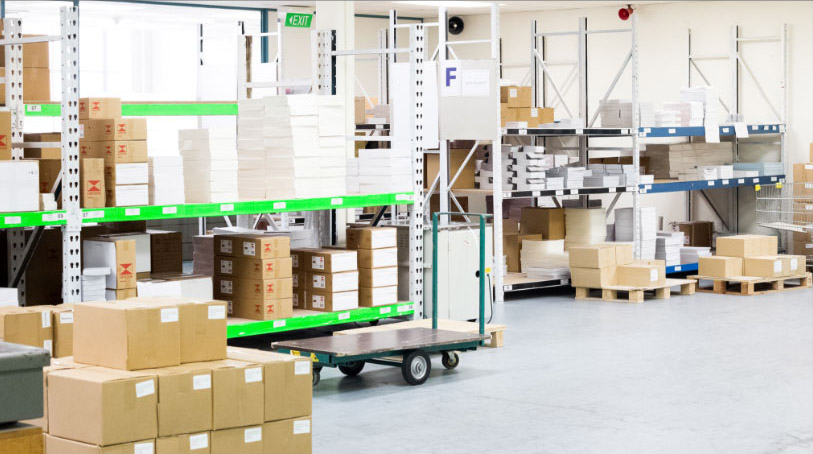 Warehouse room with many shelves of printed products